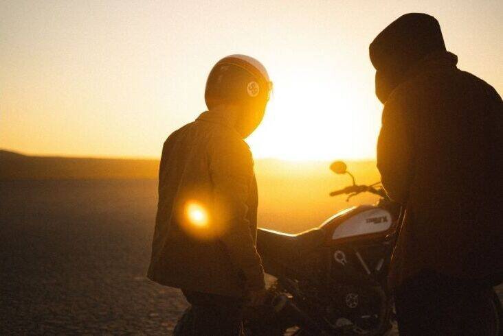 Two riders in the sunset