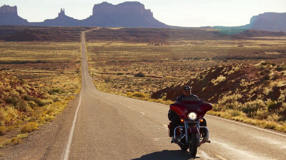 Harley-Davidson touring motorcycle riding along Route 66