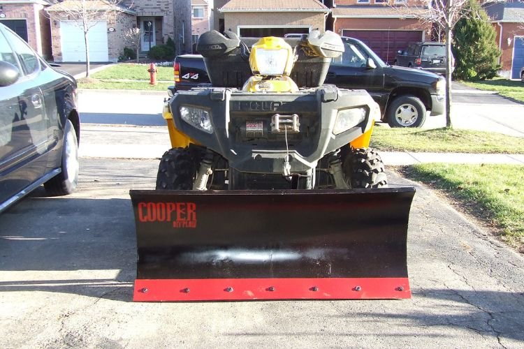 How does an ATV snow plow work