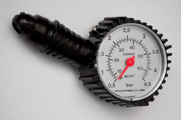 Use the gauge to check tire pressure