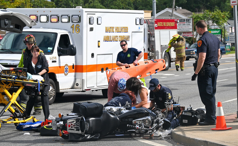 Check for injuries and call emergency services after motorcycle accident