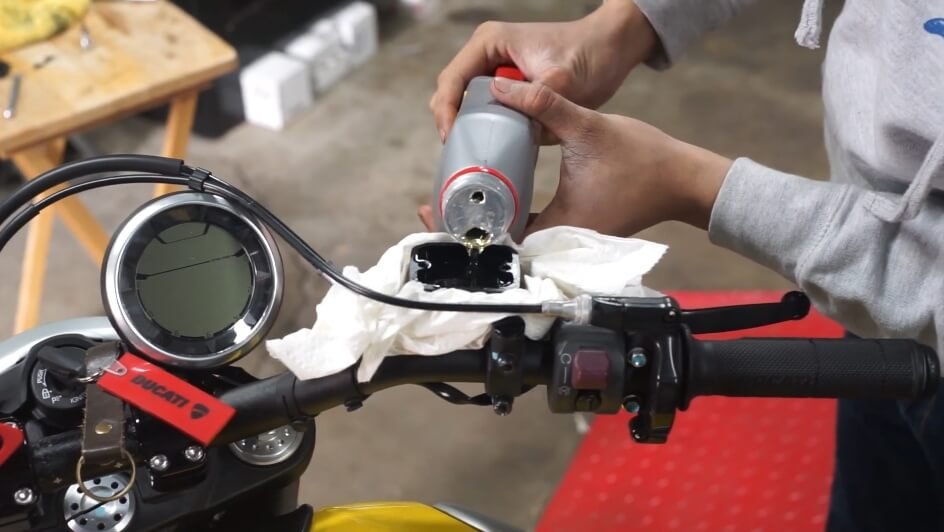 refill the reservoir to the maximum mark - How To Bleed ATV Brakes