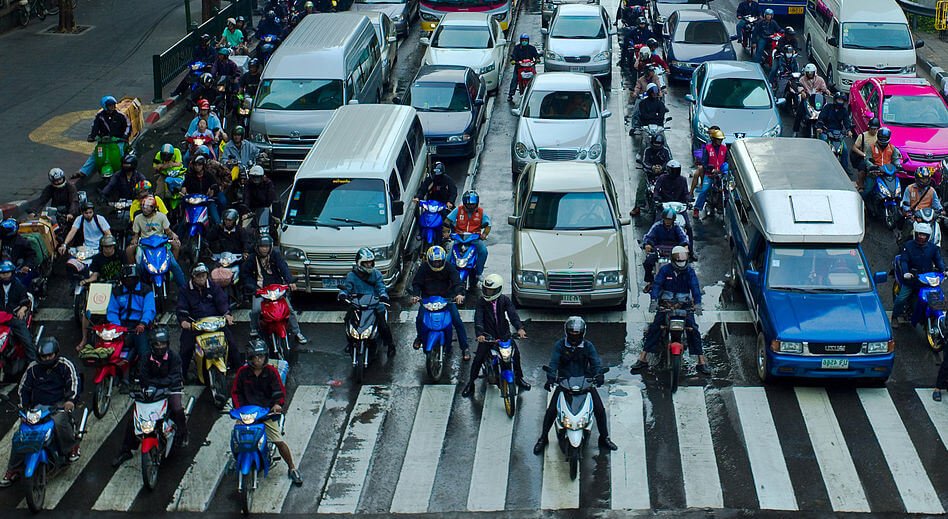 ride motorcycle in heavy traffic