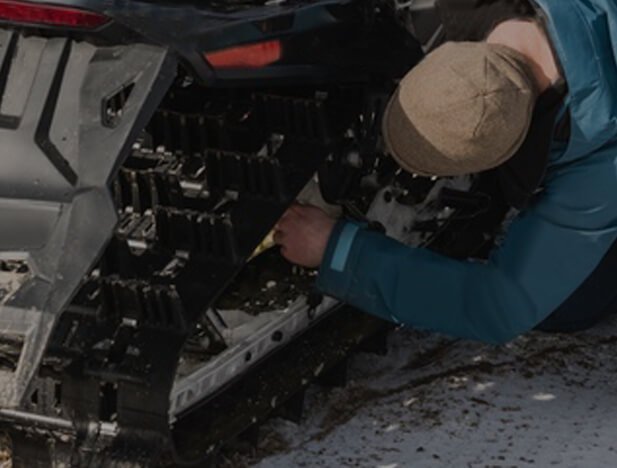 safety first when adjusting your snowmobile’s track tension