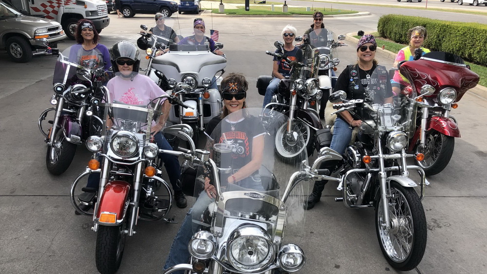 women motorcycle group riding